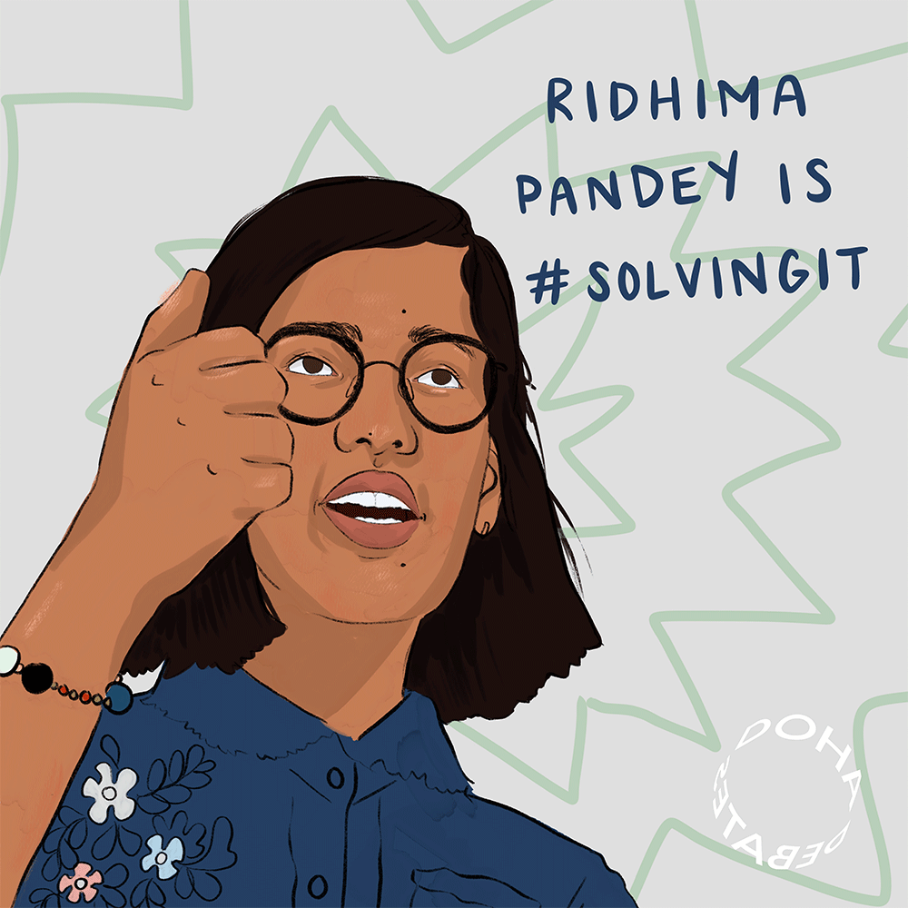 Illustration of a girl slightly facing to her left and giving a thumbs-up sign. She wears black glasses and a dark blue floral button-up shirt. She stands against a pale gray background with a light green abstract design, and text over the image reads, "Ridhima Pandey is #SolvingIt."